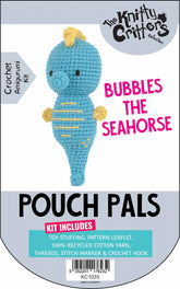 Packaging for Knitty Critters Pouch Pals I Bubbles The Seahorse crochet kit, featuring the completed amigurumi pouch and a list of included items such as toy stuffing, pattern leaflet, 100% recycled cotton yarn, and crochet hooks.